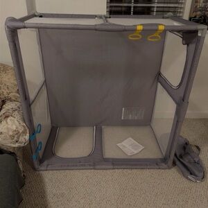 Gray Playpen with Yellow and Blue Accents